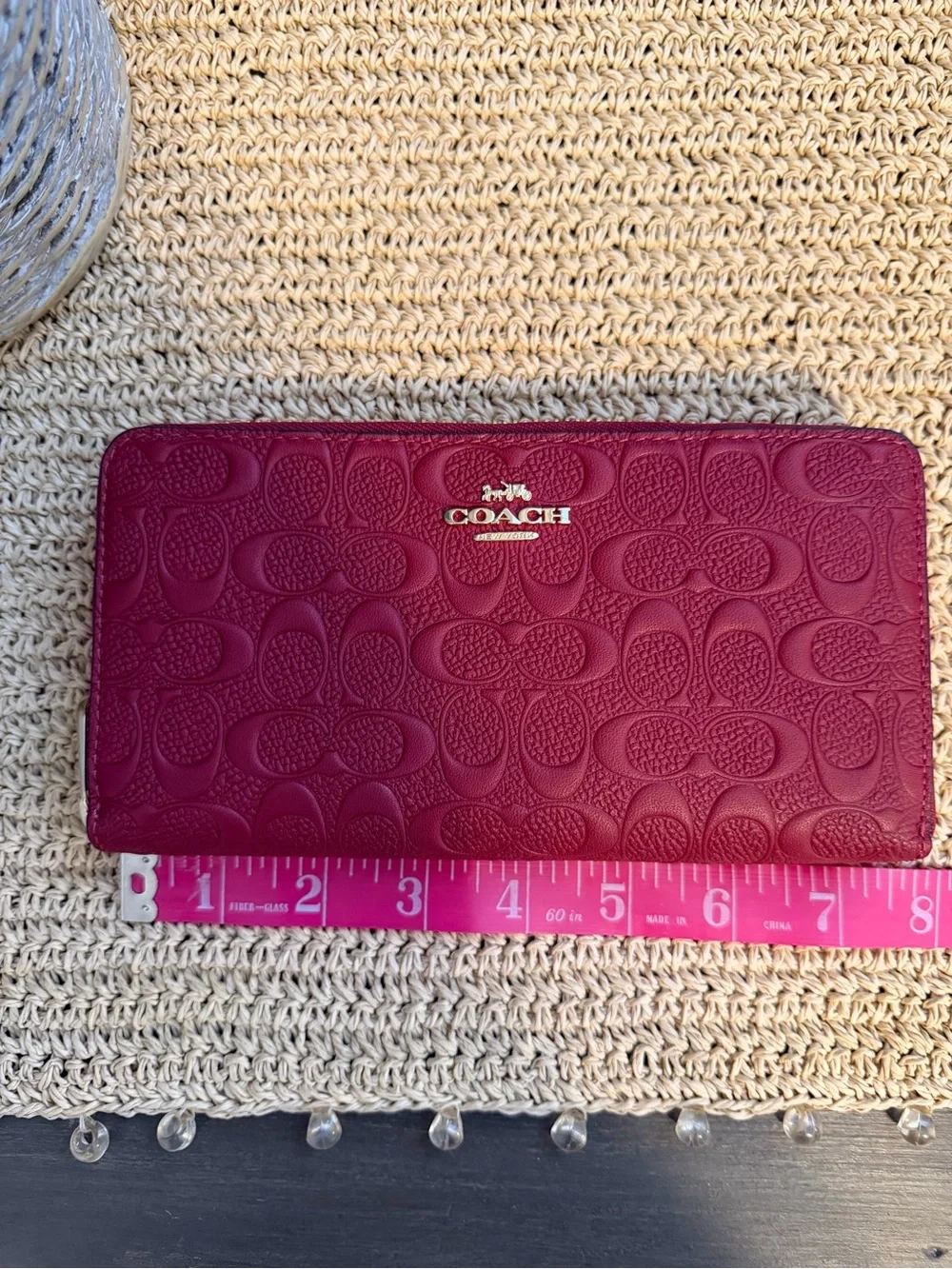 Coach Signature Embossed Continental Wallet in Berry